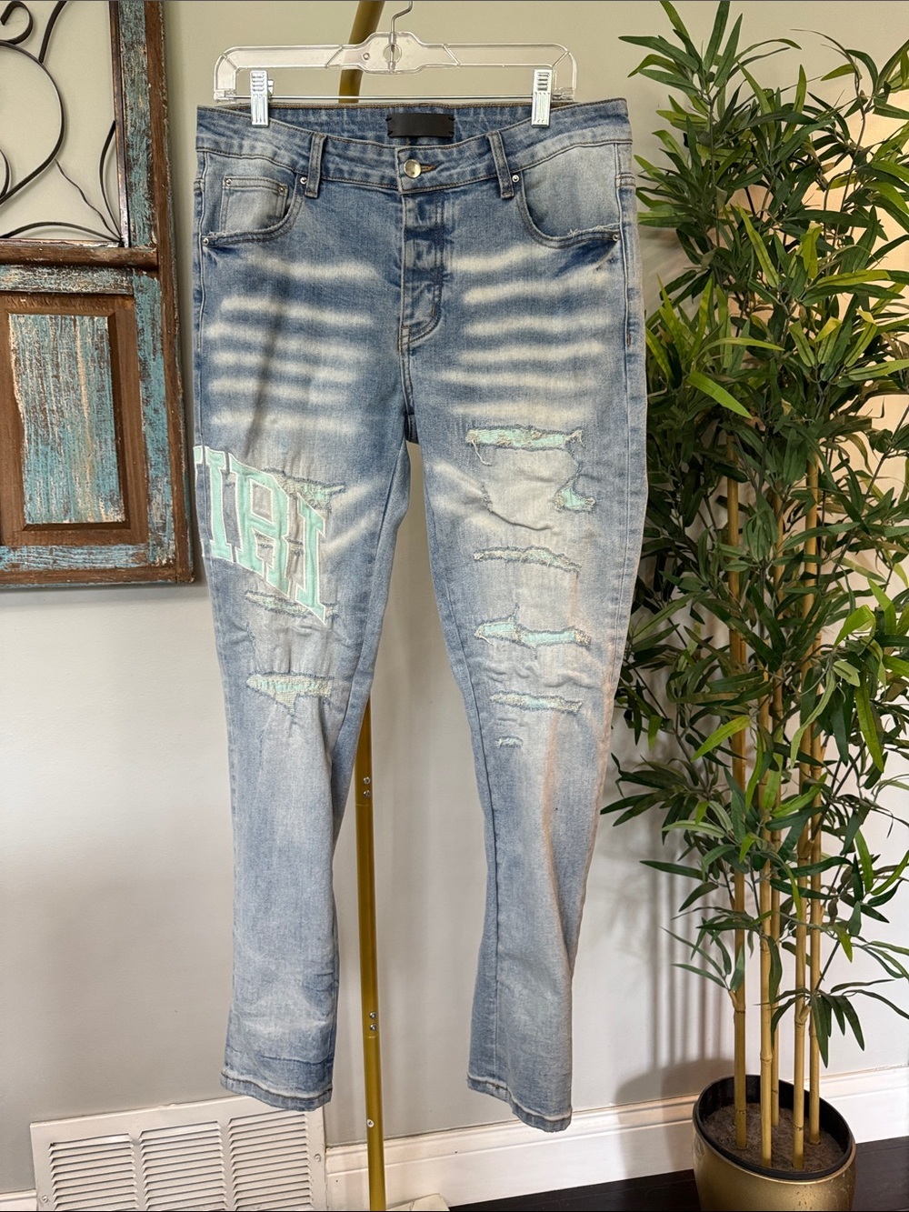AMIRI moto jeans Light Blue Distressed Skinny Jeans with Mint Patch 34